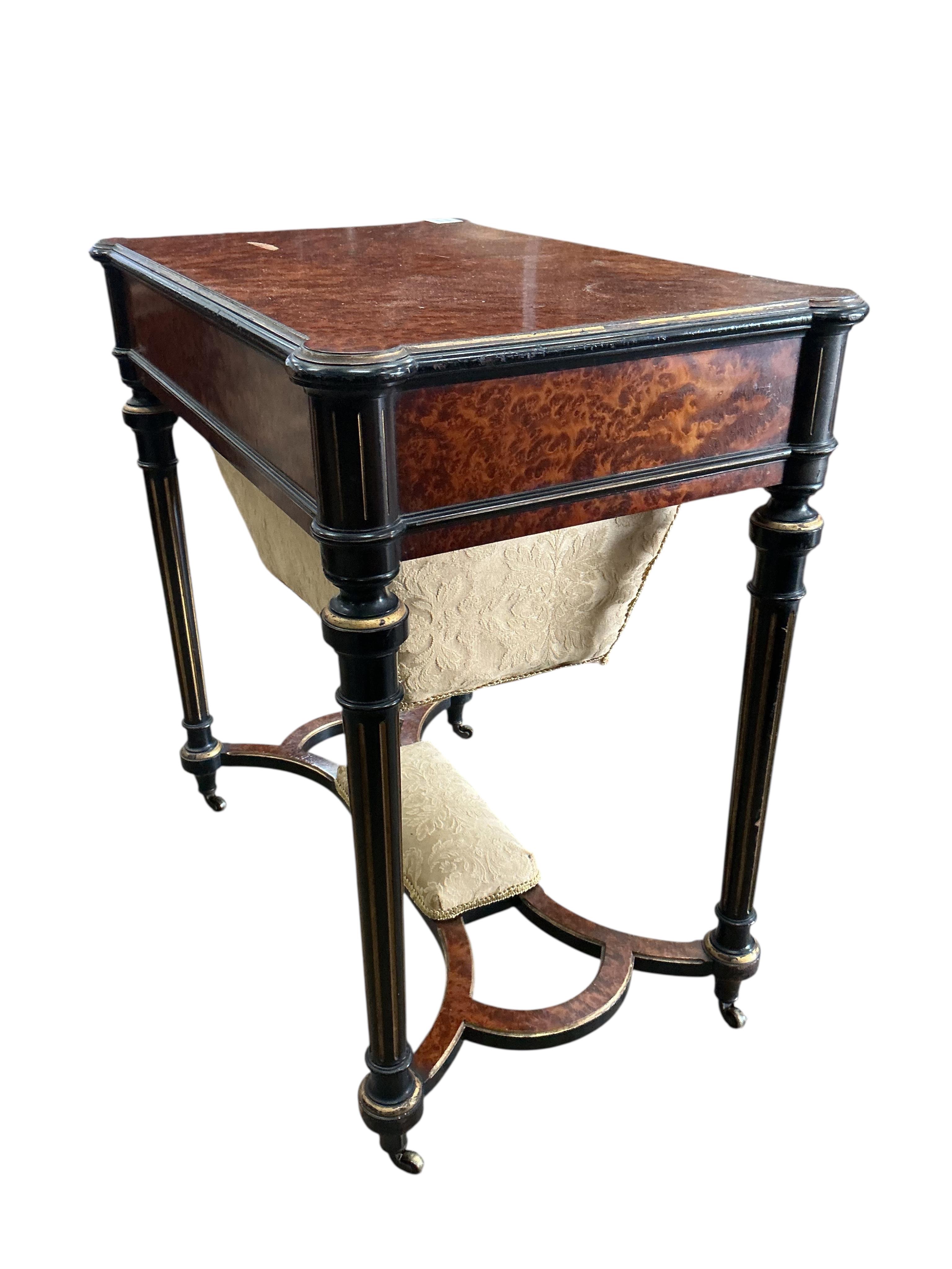 A late 19th century parcelgilt and ebonised amboyna work table, width 68cm, depth 44cm, height 72cm